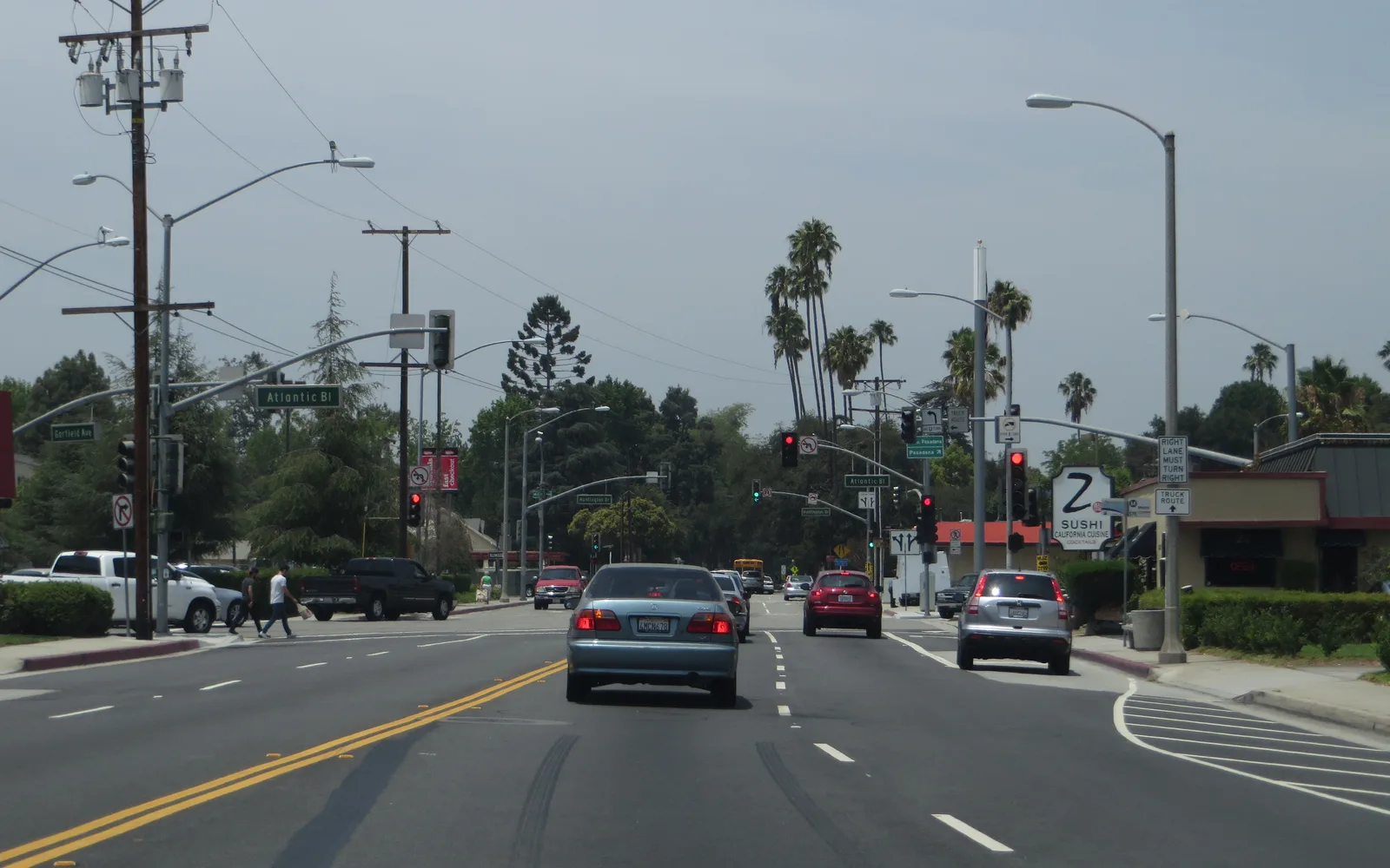 A residential street in Alhambra, California, showing homes and tree-lined neighborhood character